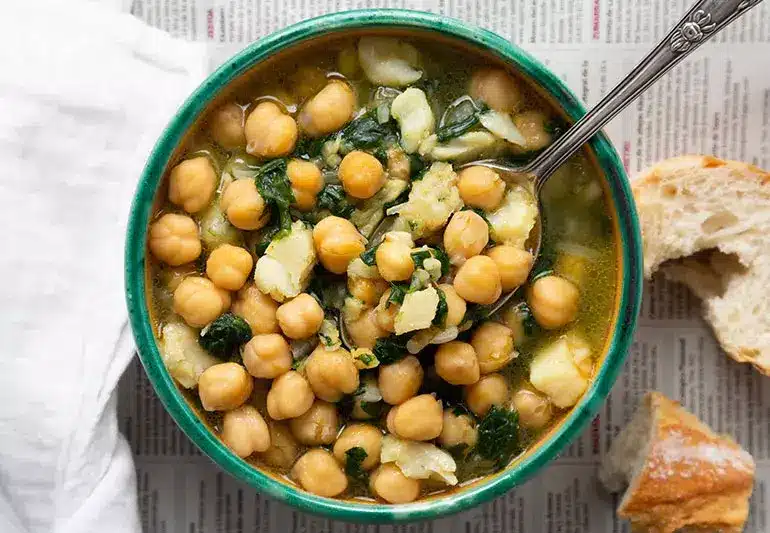 a bowl of soup with a spoon